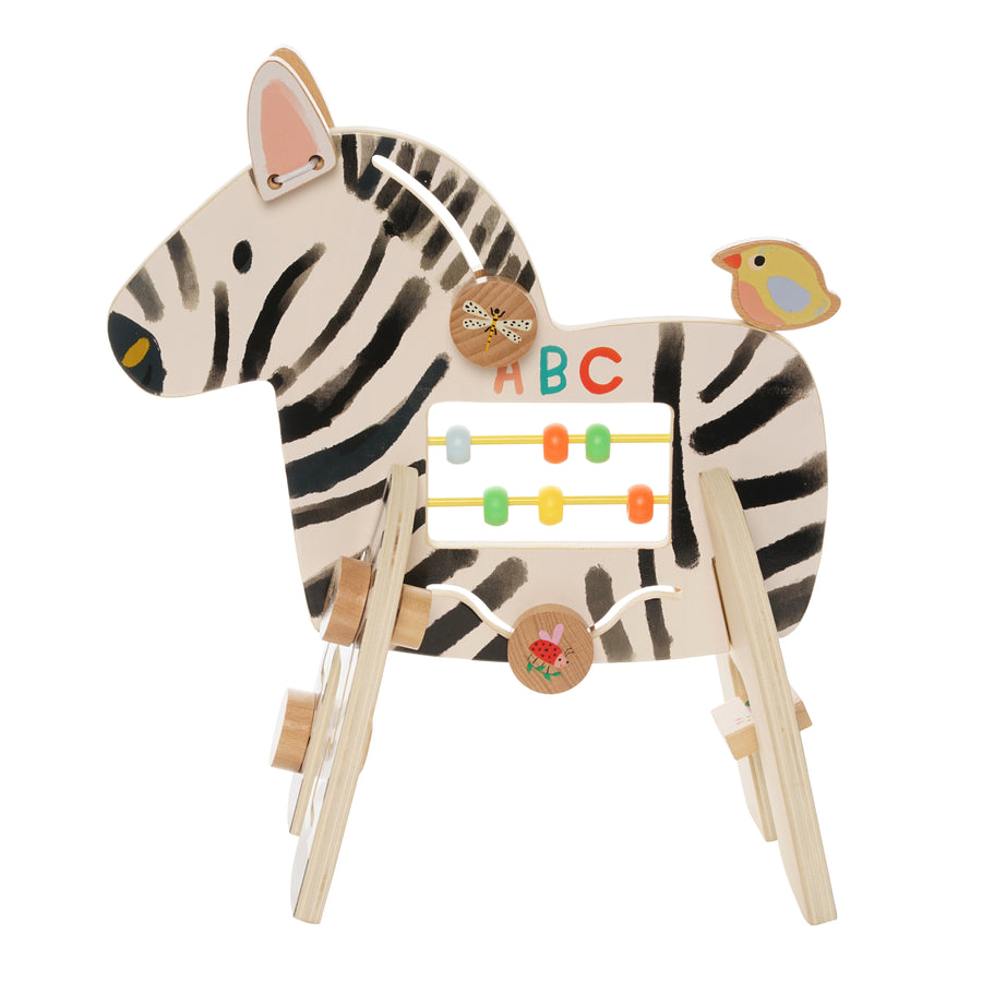 Side view of a Manhattan Toy wooden zebra activity center featuring bead runs, a springy bird, spinning flower, and clacking ears.