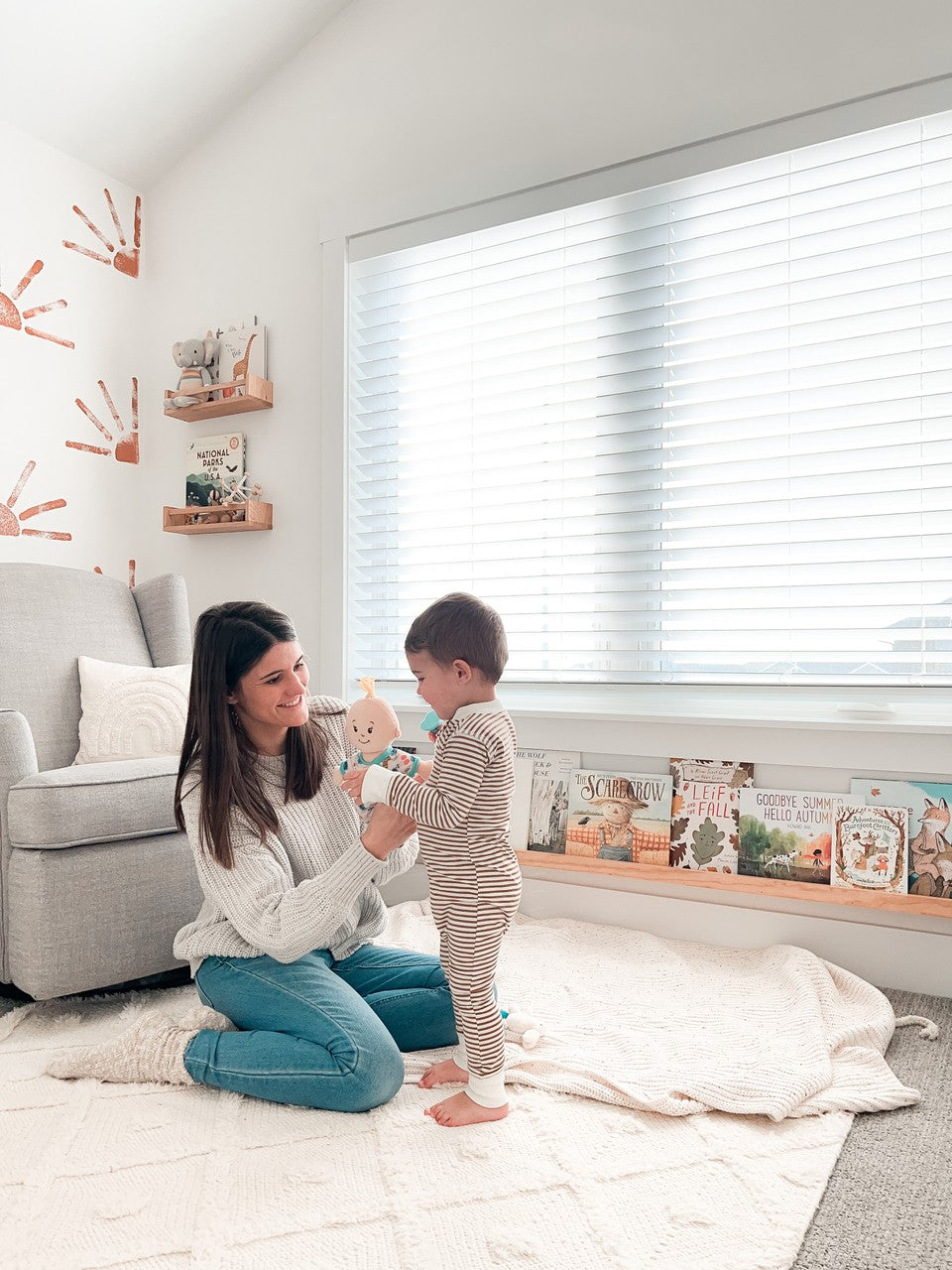 Mother and son playing with doll in playroom. Click/tap to view on Instagram.